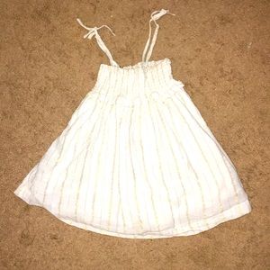 I am selling a whit/gold again puffy tank shirt!